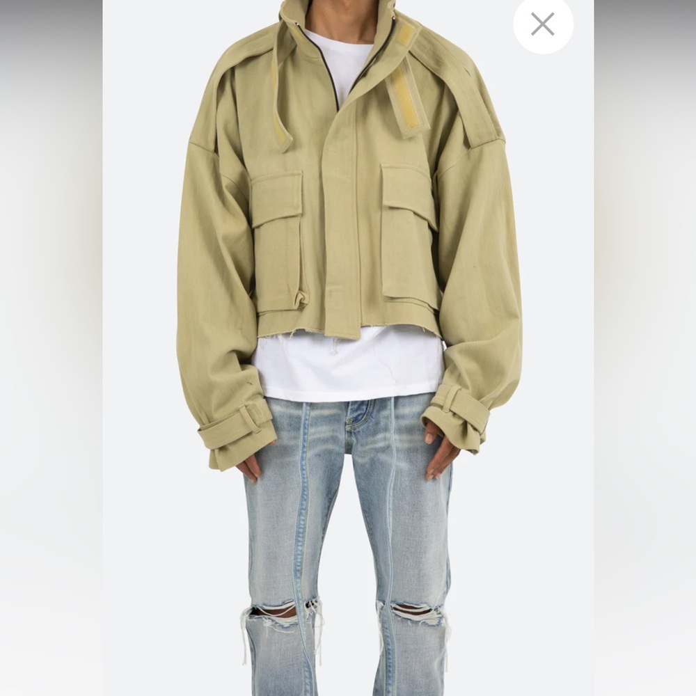 Tan cropped jacket.